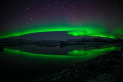 aurora borealis is dancing over the...